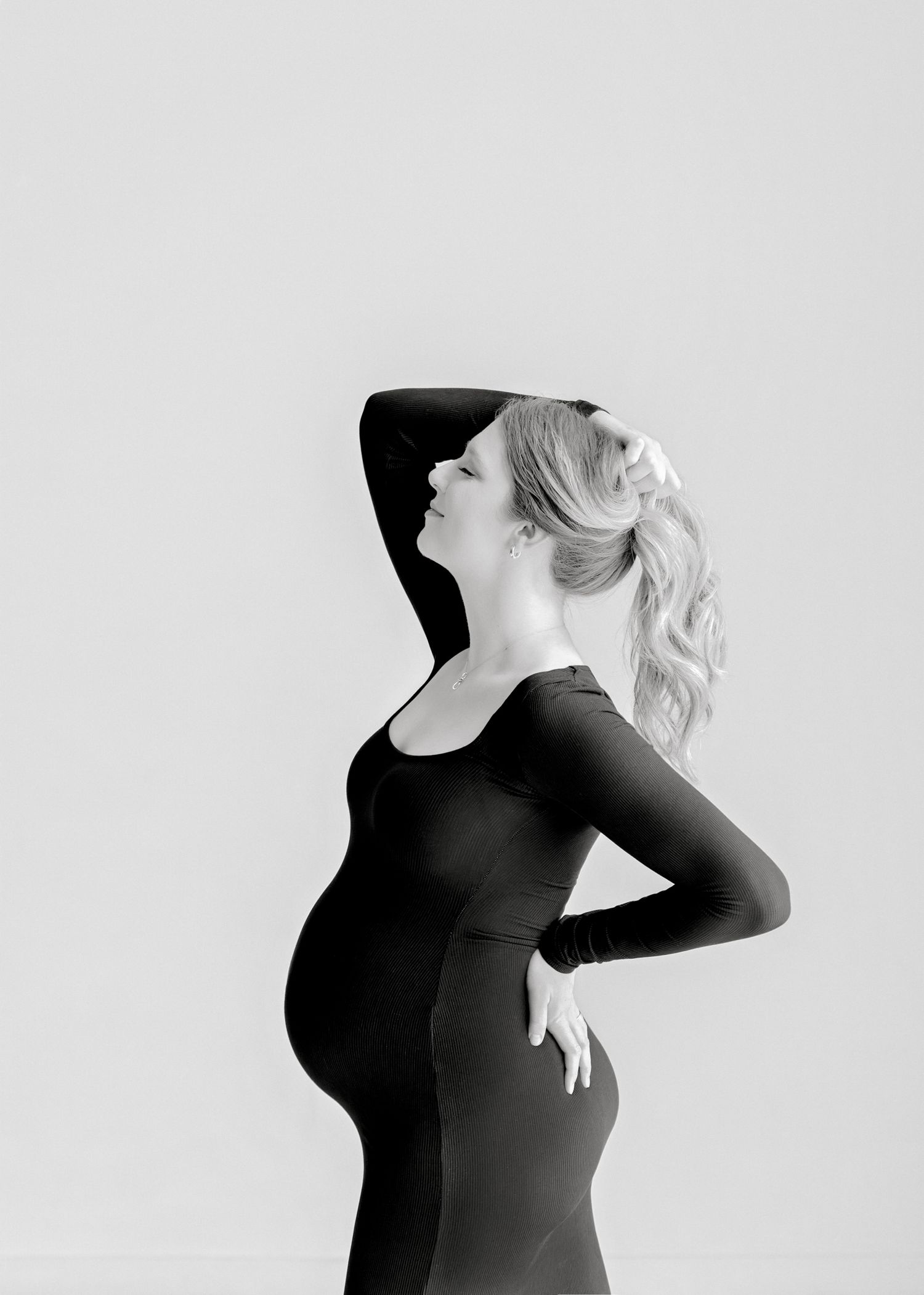 Series of artistic black and white profile silhouettes showing a figure in a black top against a light background.