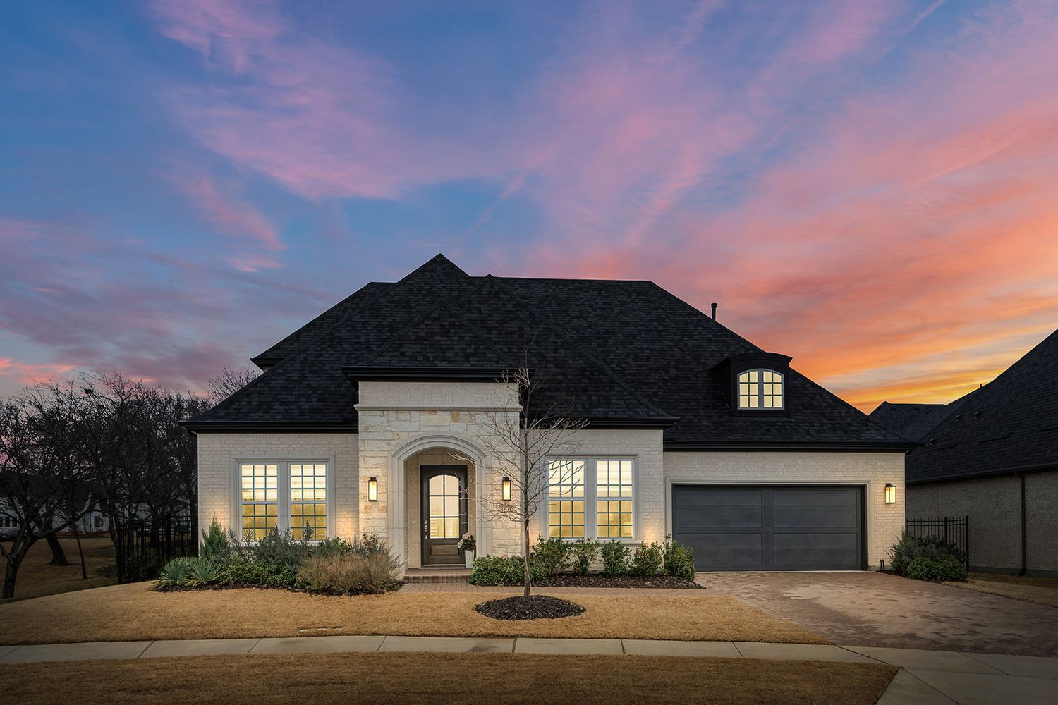 Multiple exterior photos of modern residential homes at sunset showing beautiful pink and orange sky backdrops.