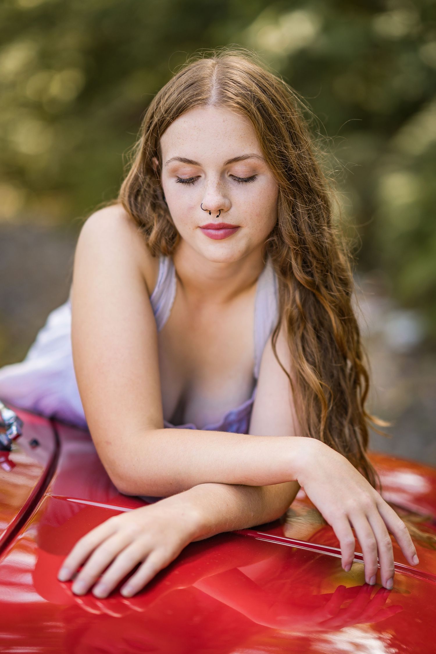 styled photography senior mini session with red classic mini Cooper car and seasonal flowers