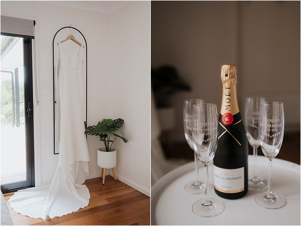Wedding dress on hanger and champagne setup with glasses on table.