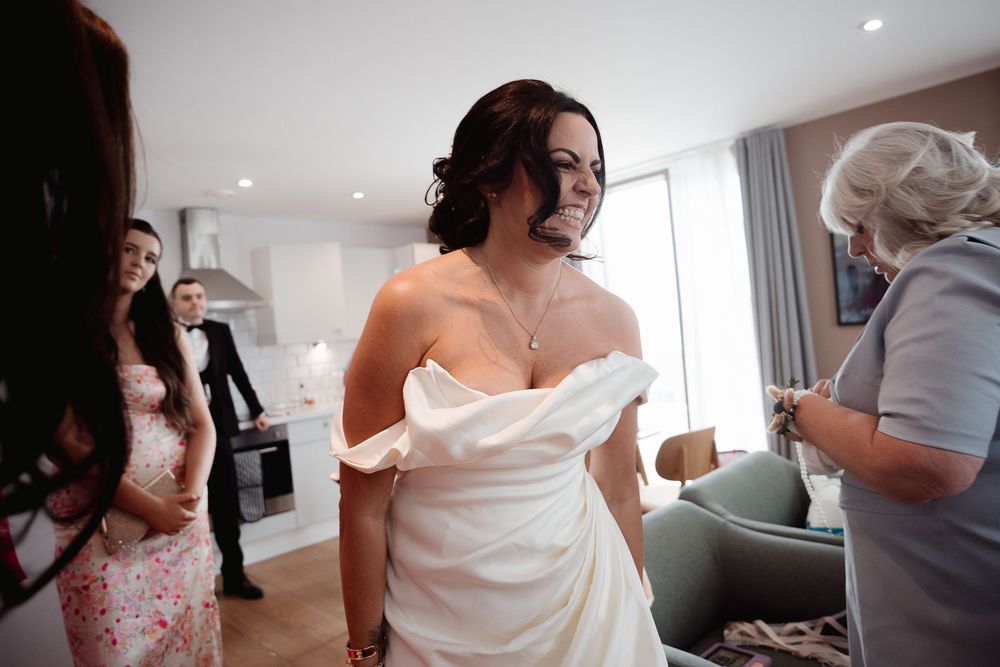 A collection of candid moments during wedding preparations showing people getting ready in bridal suite settings.