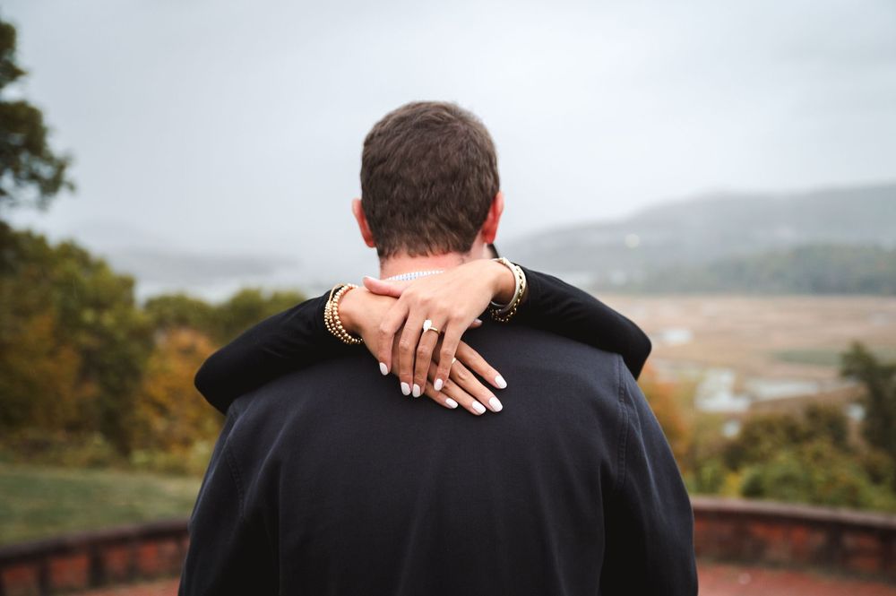 A newly engaged couple hold each other at Boscobel House & Gardens in Garrison, New York