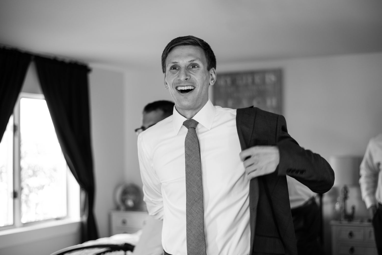 Black and white candid moments during wedding preparations.