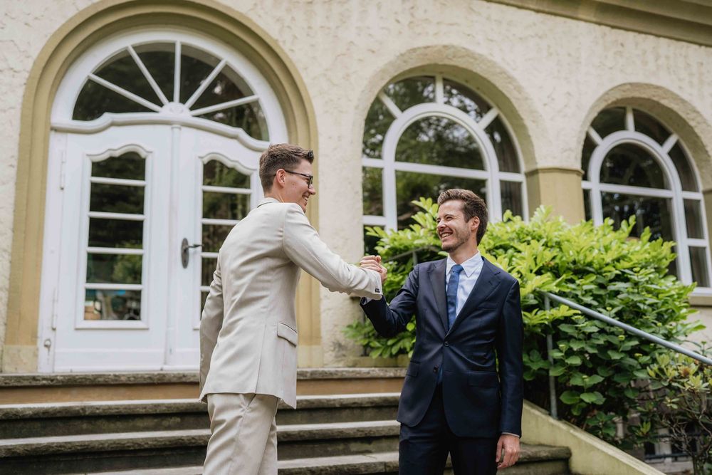 Architectural detail of arched windows and stone steps at an elegant venue.