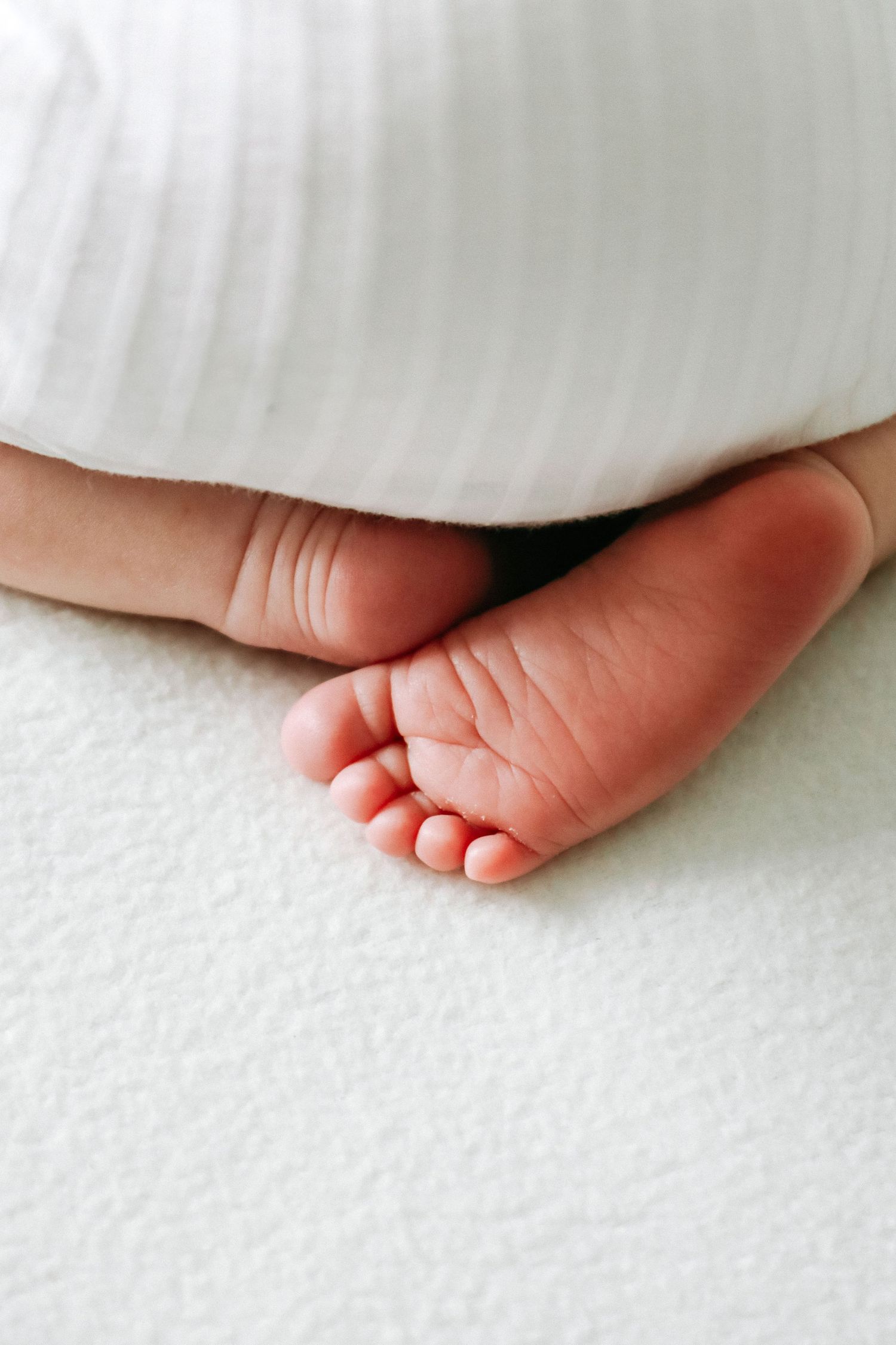 Nottingham newborn photographer calm baby led session studio NG16 close up tiny foot detail shot