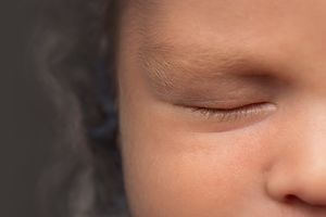 Close-up detail shots of a sleeping baby's facial features.