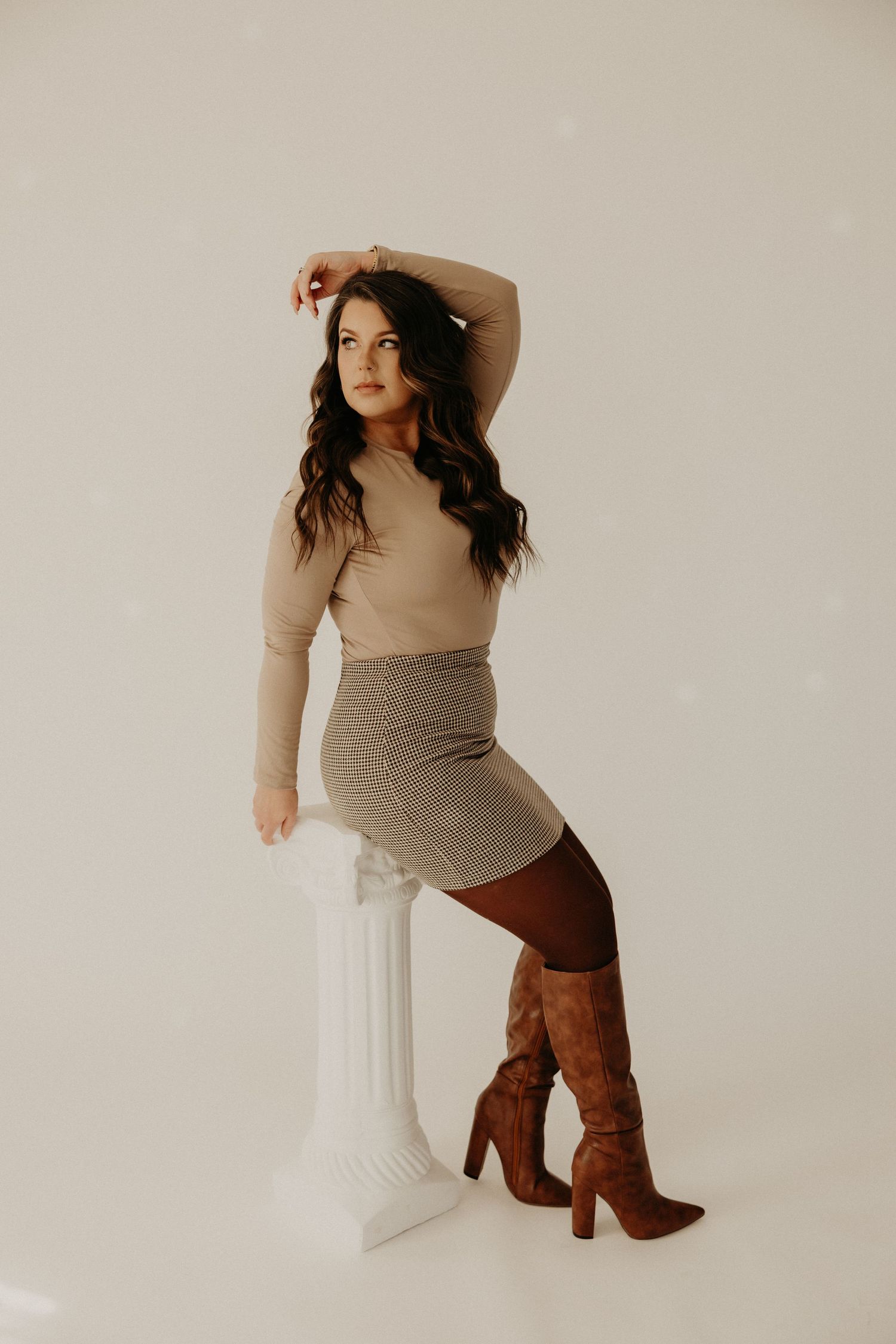 Creative branding photography for a businesswoman, showcasing her brand's personality with clean, stylish imagery.