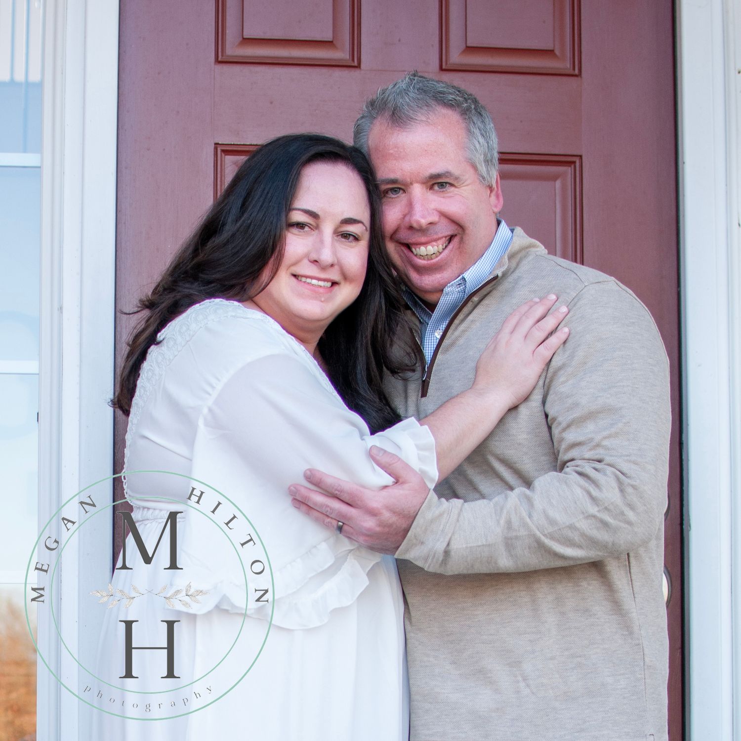 Couple standing by door photo