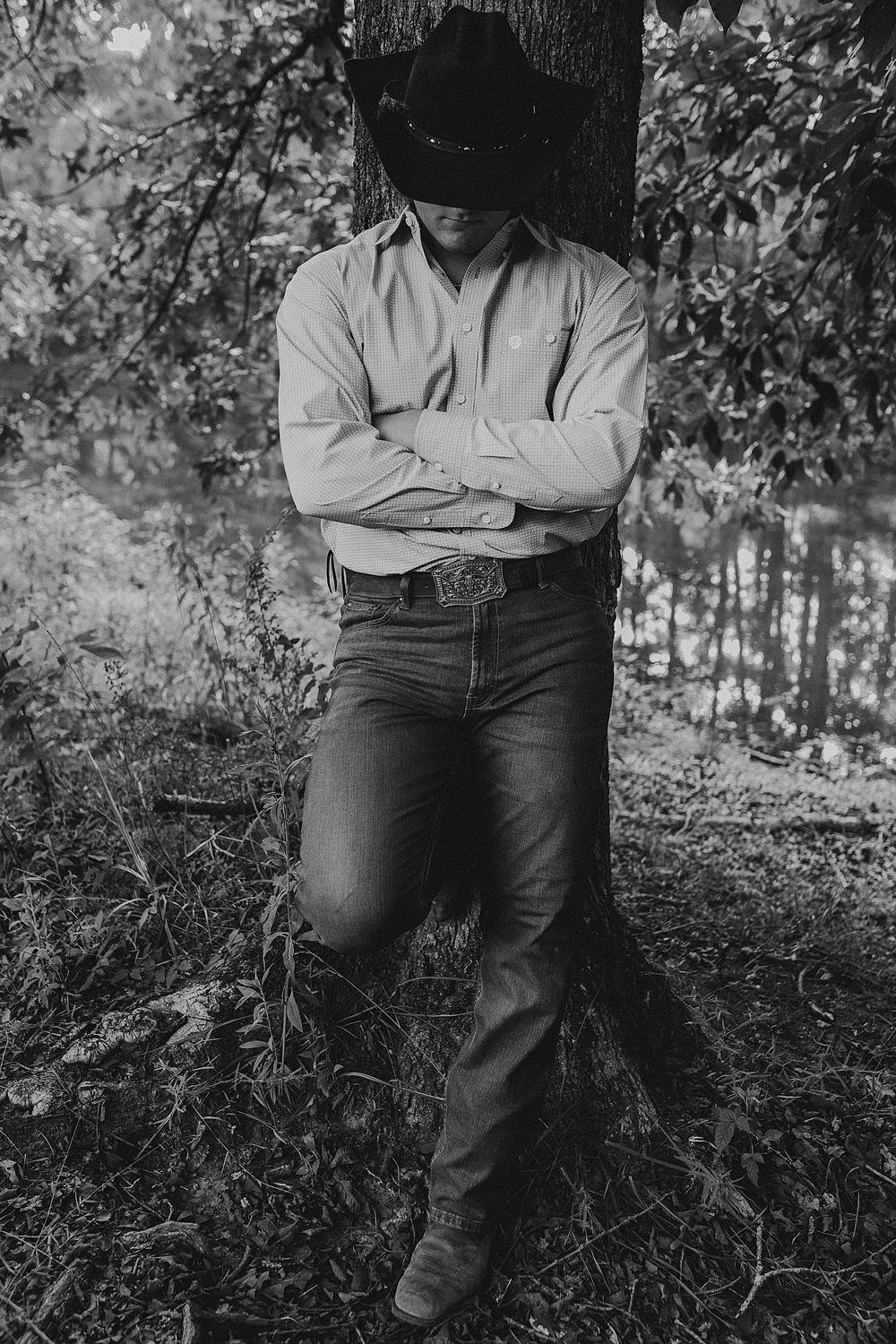 Black and white artistic photo series showing a person sitting against a tree trunk in a forest setting.