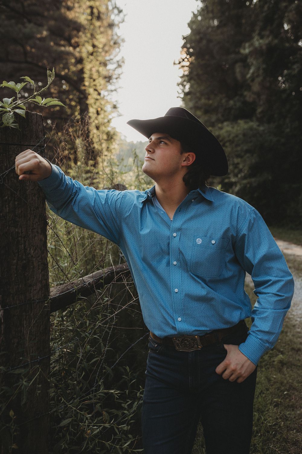 Person in blue western shirt and black hat strikes dramatic poses against forest backdrop in multi-image sequence.