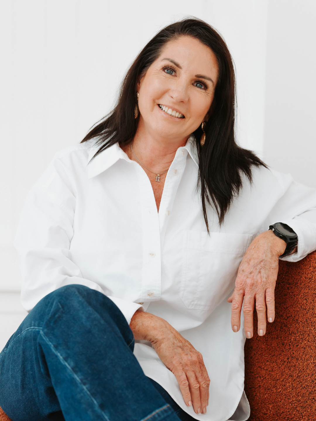Janette in white shirt posing for headshot portraits on the Sunshine Coast.