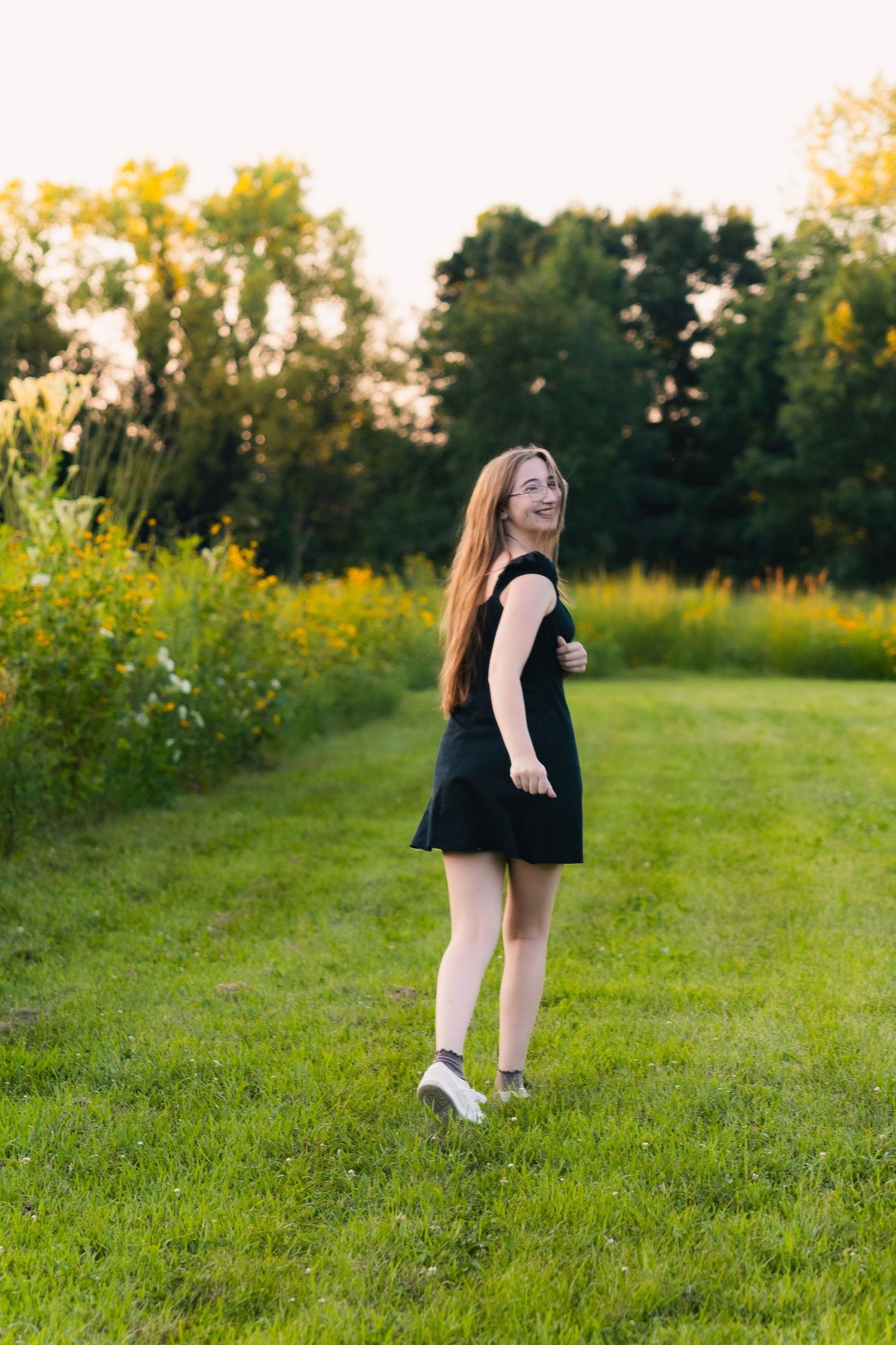 festge county park cross plains wisconsin senior photo location natural wildflowers yellow greenery field epic views rustic stone wall wi