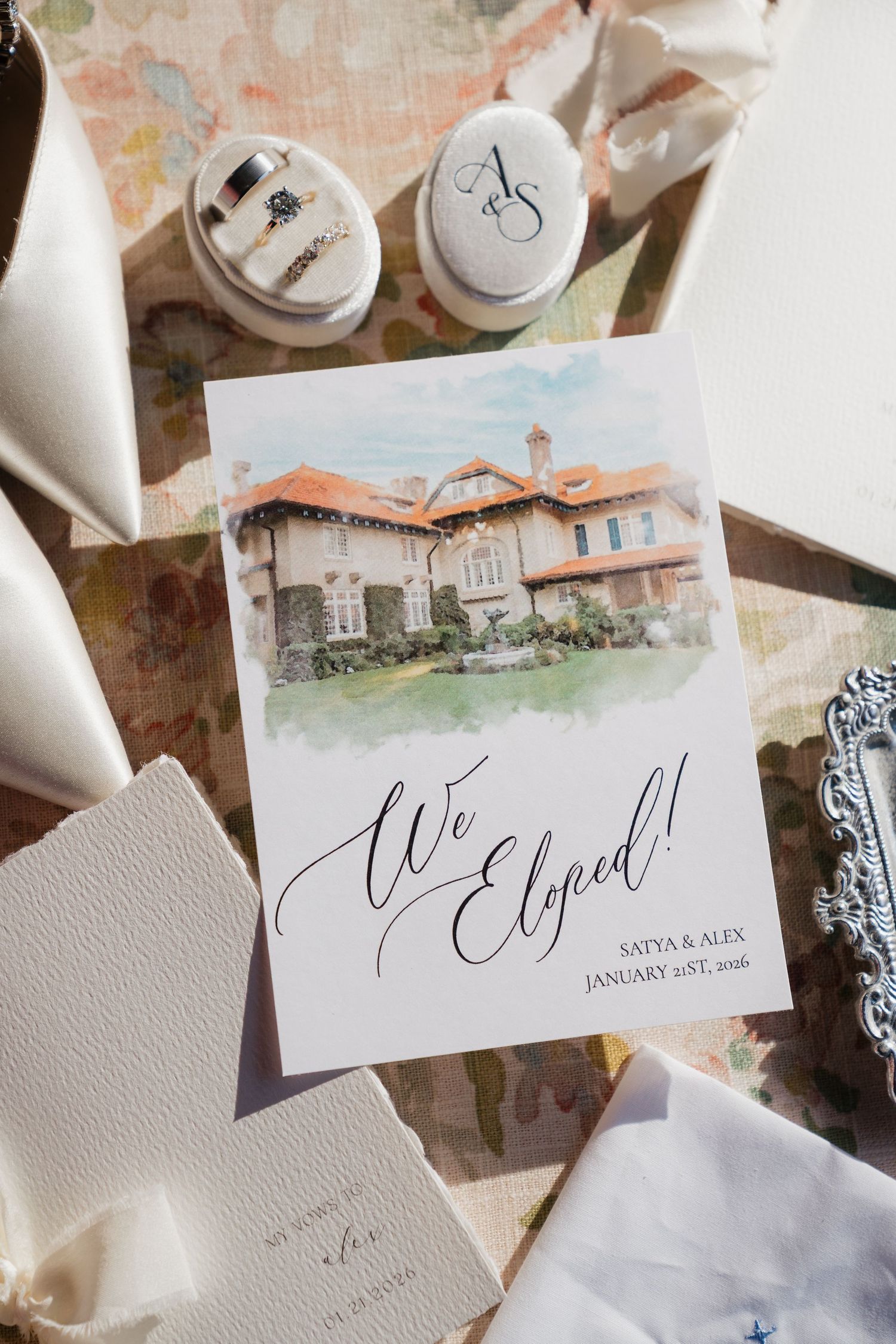 Elegant elopement announcement card with watercolor mansion illustration for Satya & Alex, January 21st, 2026.