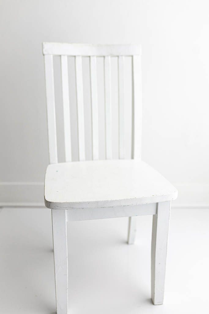 Simple white wooden child's chair; Children's photographer prop in Perris, California.