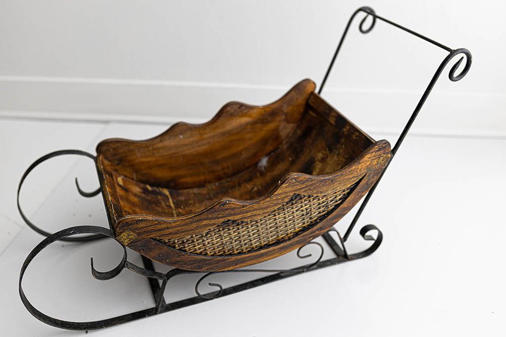 Decorative wooden sleigh for Christmas themed photos; professional photography studio Menifee CA.