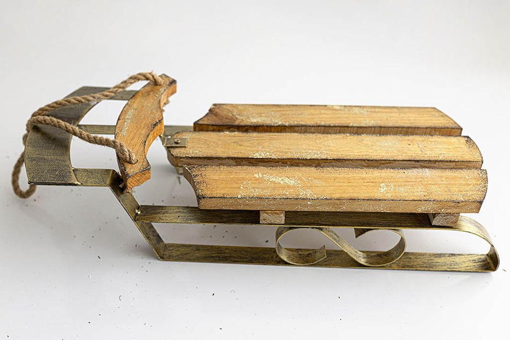 Vintage wooden sled for Winter themed baby and child photoshoot near Perris, California.