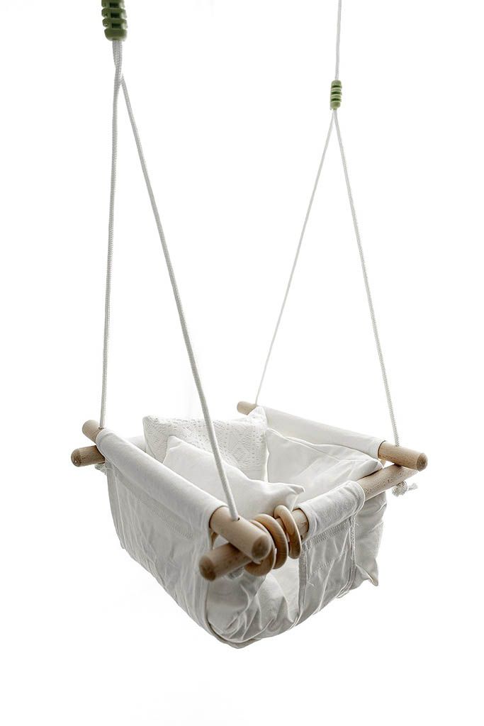 Minimalist white fabric baby swing on a white background. Timeless baby photography studio in Menifee.