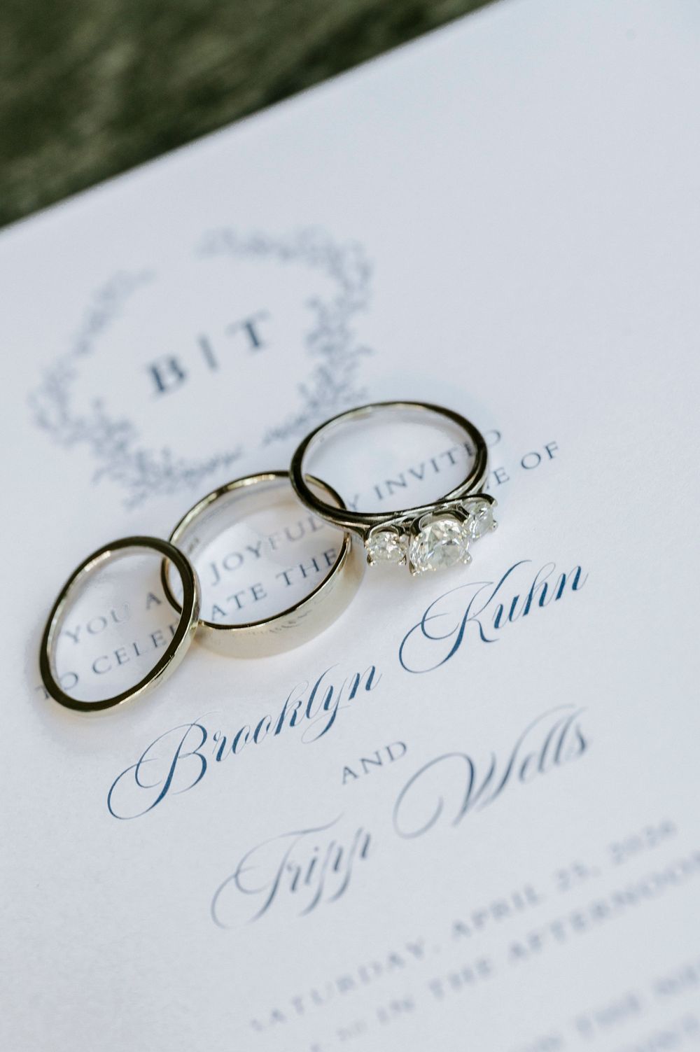 Wedding rings and invitation for Brooklyn Kuhn and Tiger Wells on April 25 2026.
