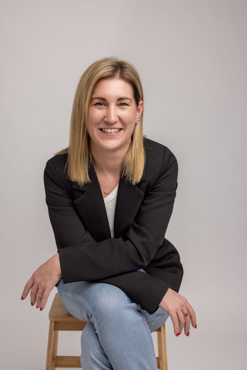 Women in black blazer and jeans, branding image session taken in Warkworth studio