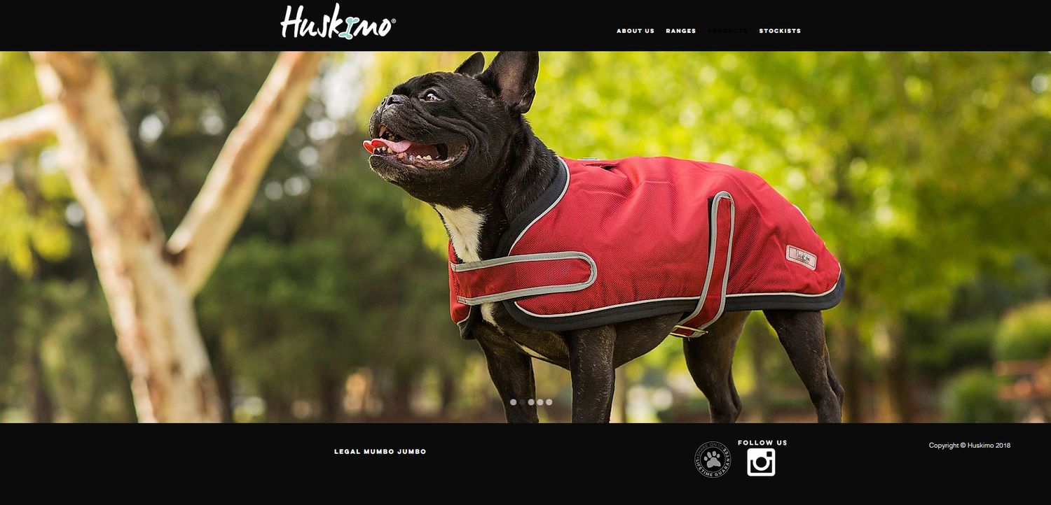 French Bulldog modelling red Huskimo jacket