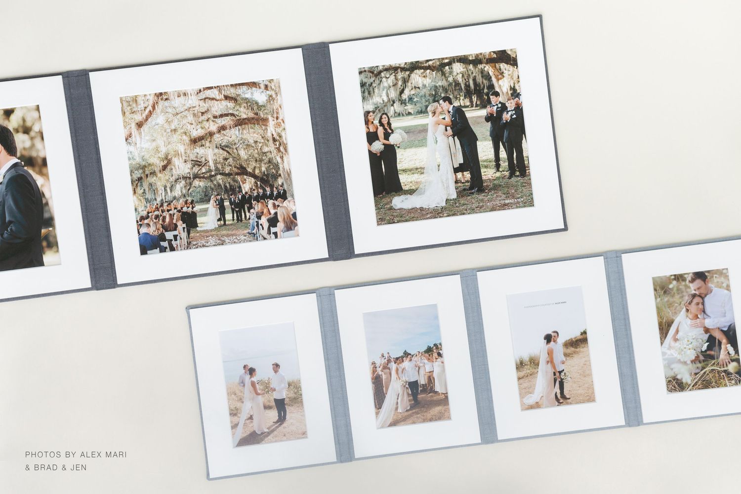 Elegant wedding photo album open to pages featuring outdoor ceremony and couple portraits in soft neutral tones.