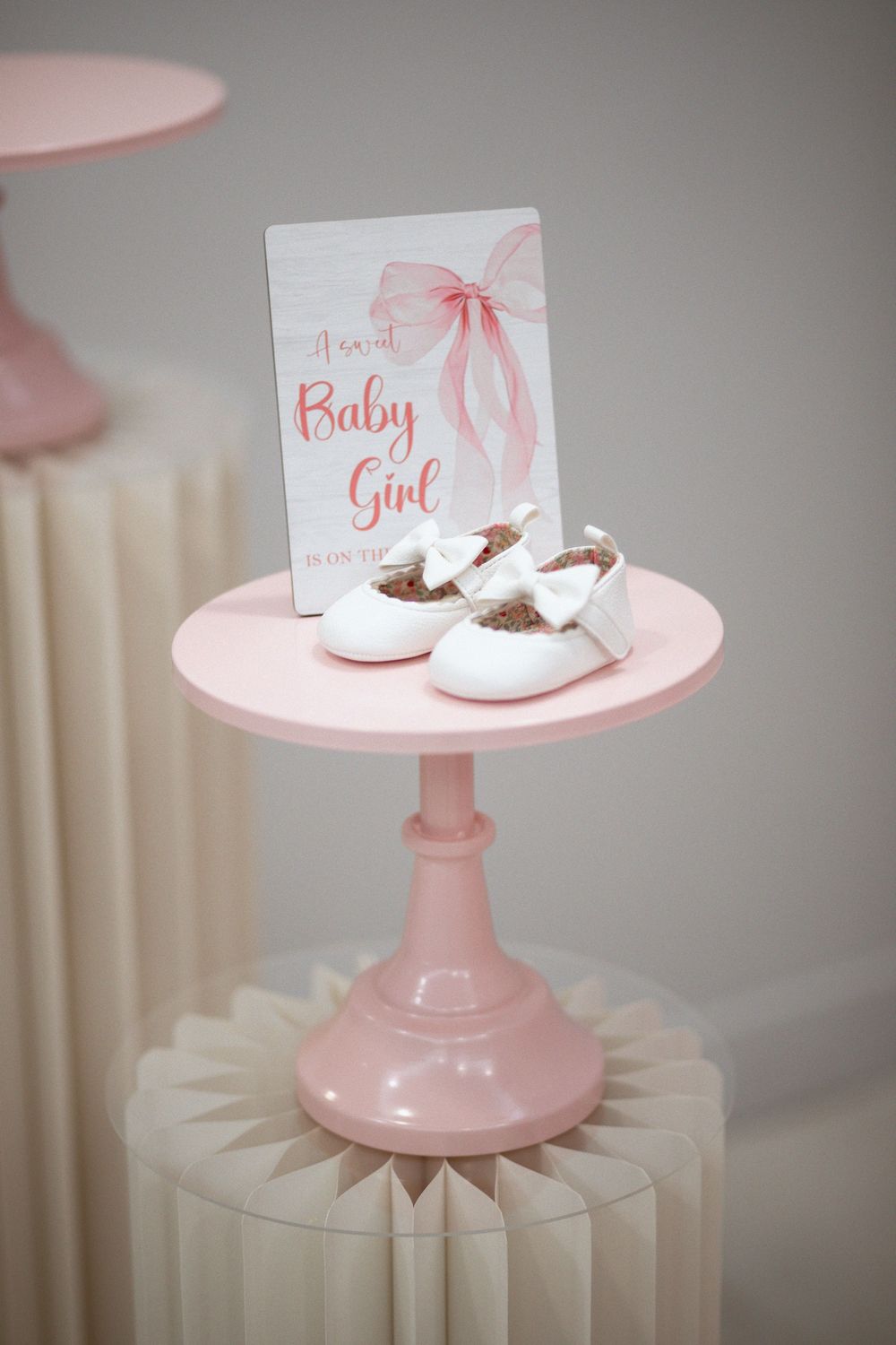 Pink baby shoes decoration at a miami baby shower. It's a girl!