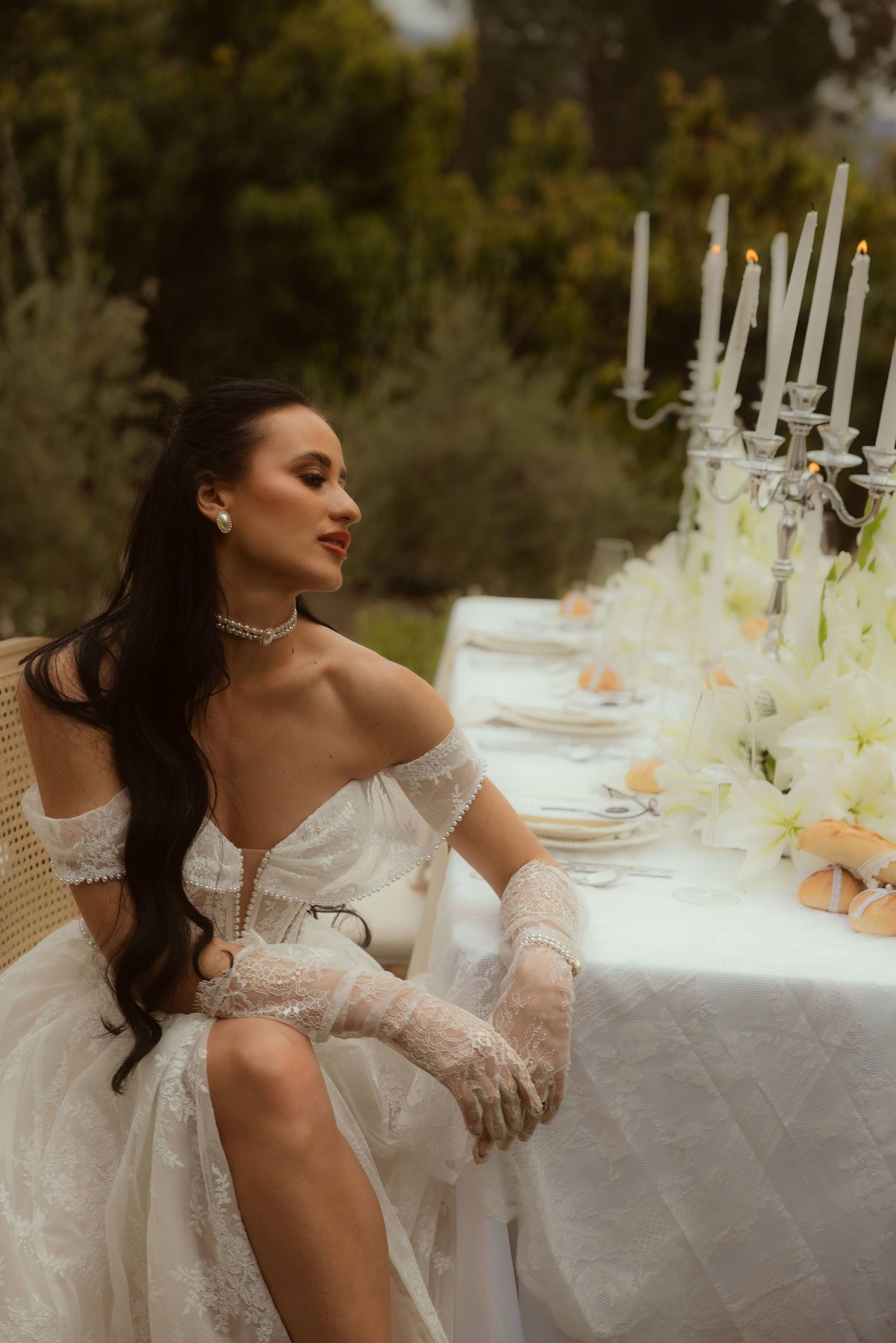 A bride in an off-shoulder white gown at her Ojai elopement.
