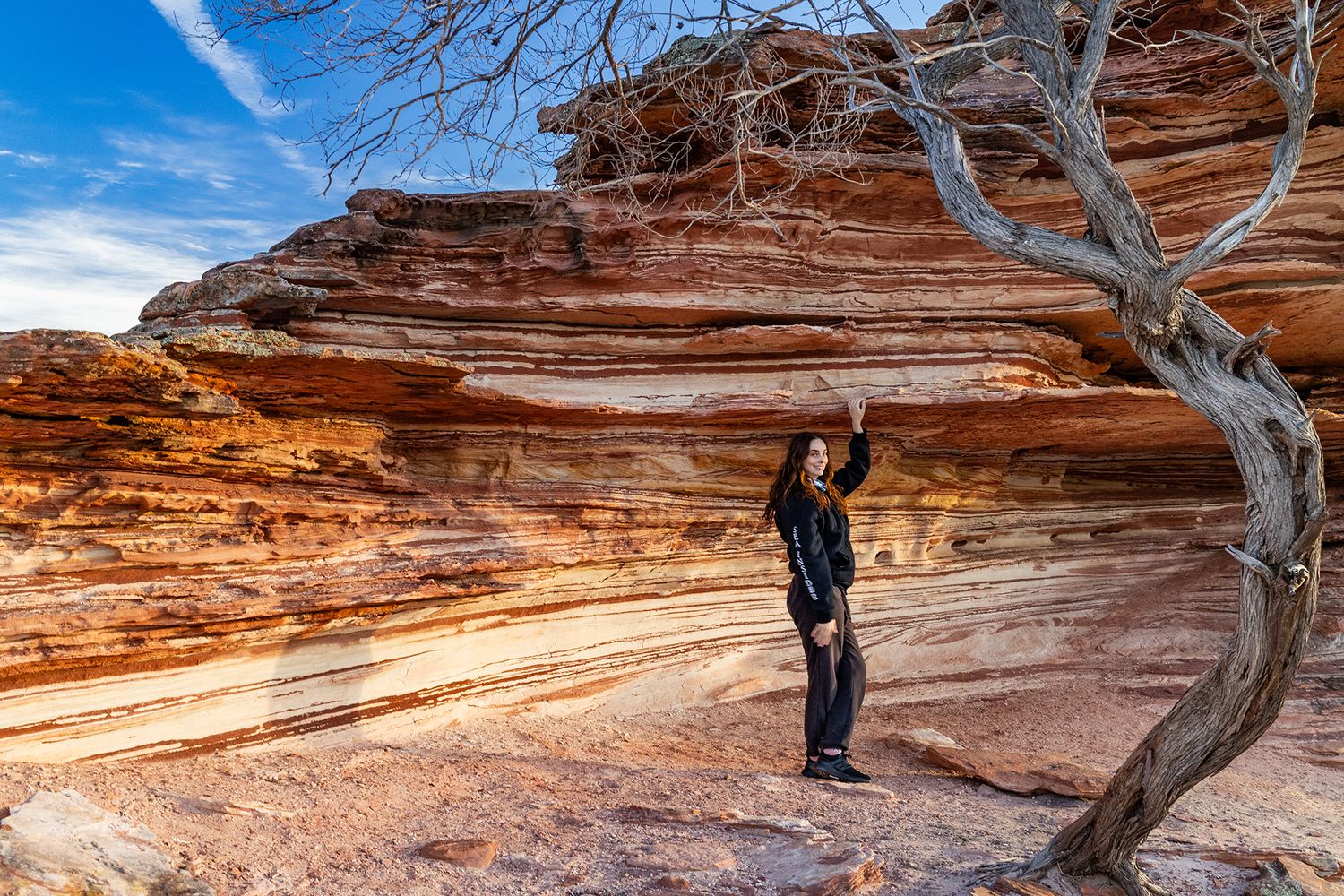 Photographer posing by the stunning rock wall formations in Kalbarri National Park near Natures Window