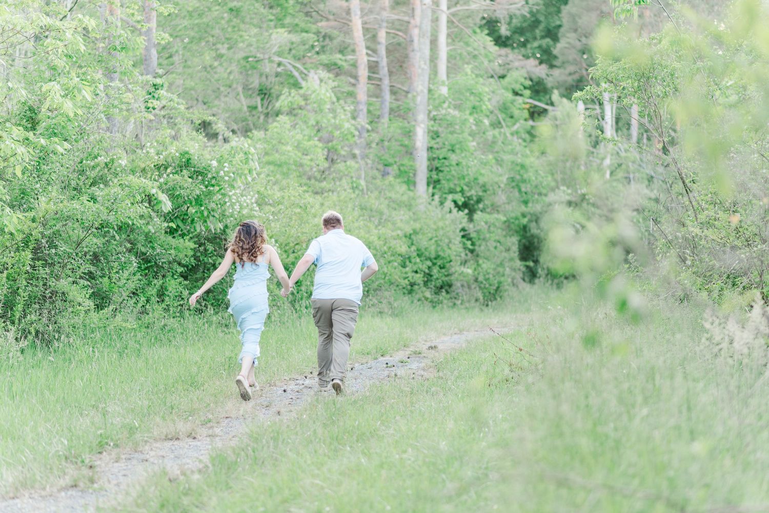 Engagement session at Quemahoning Reservoir in Johnstown Pennsylvania, running away together