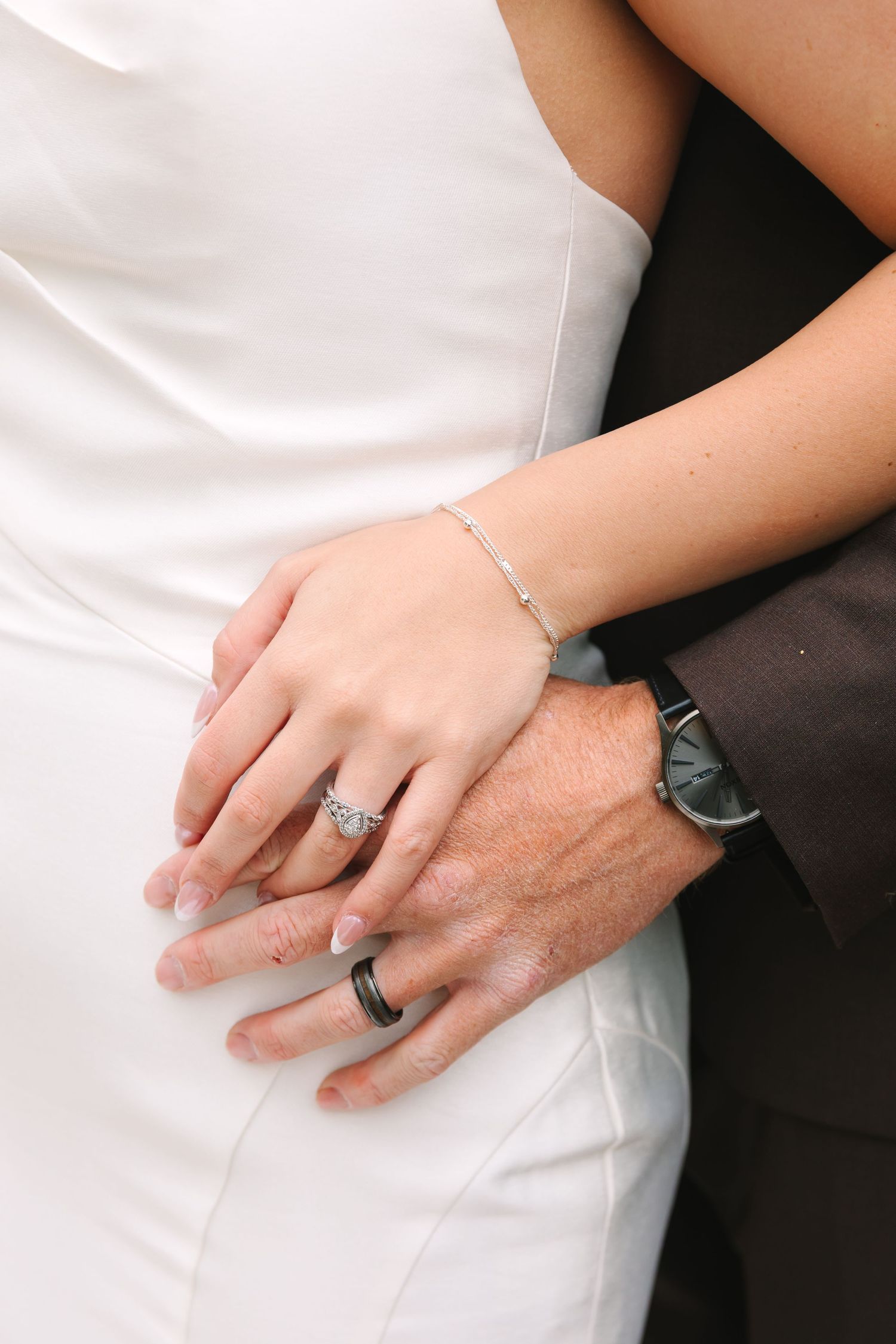 A beautifully styled wedding detail photograph featuring carefully curated elements such as wedding rings, florals, and invitation details.