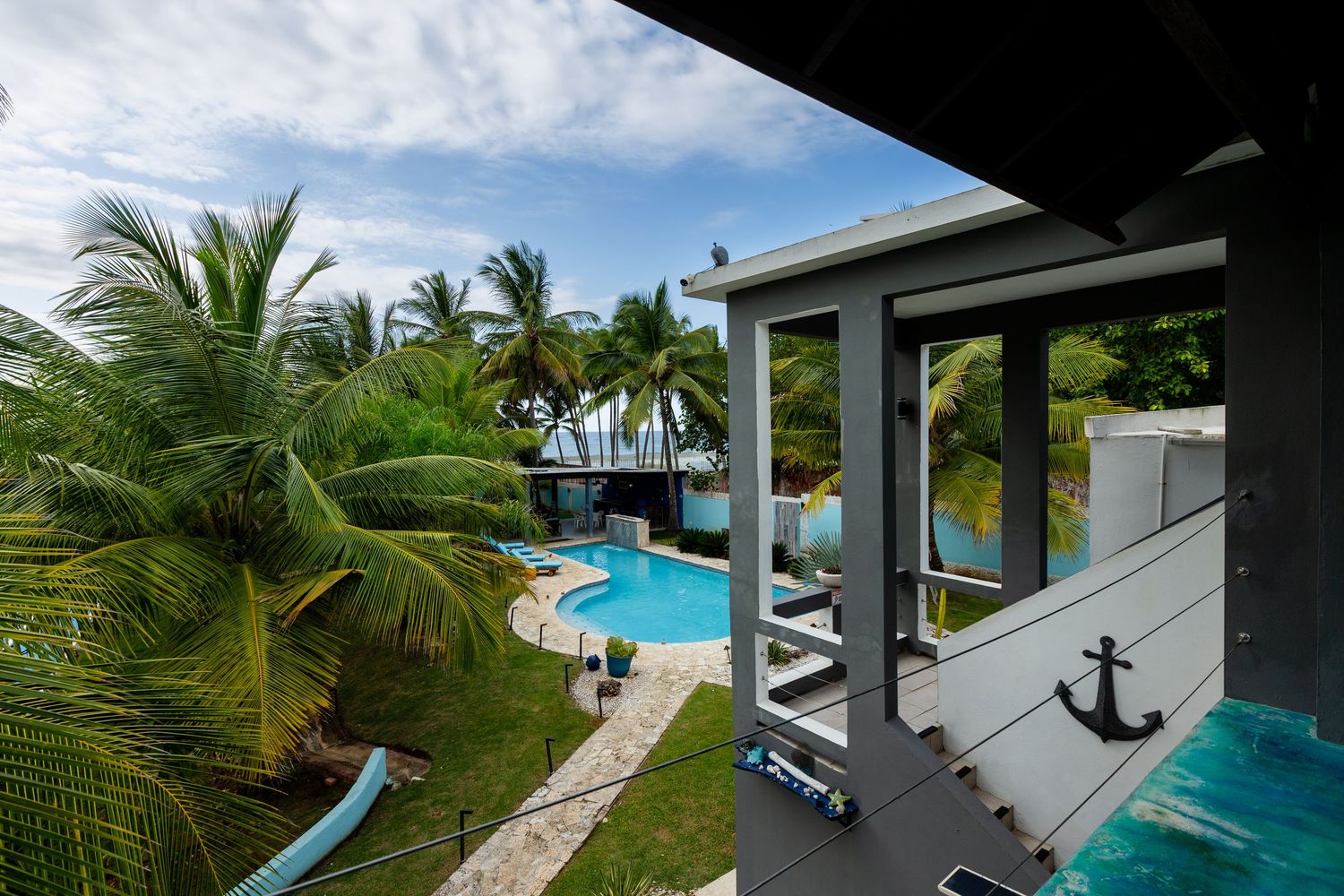 View of pool from upstairs seating area. Beach house in Vega Baja, Puerto Rico.