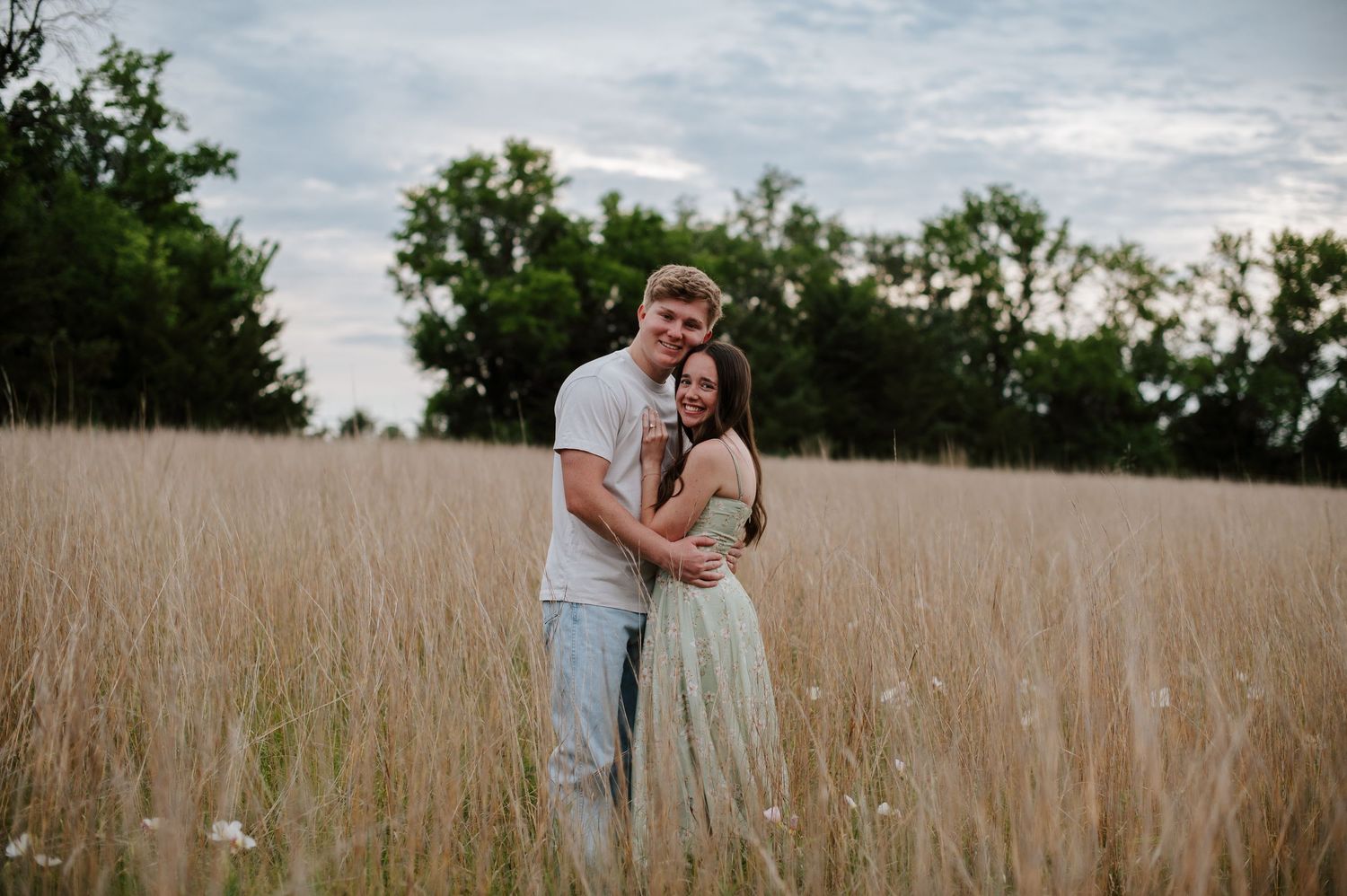 Wichita KS outdoor engagement photos in nature location Andover, couple photos in field with flowers, small elopement wedding photographer