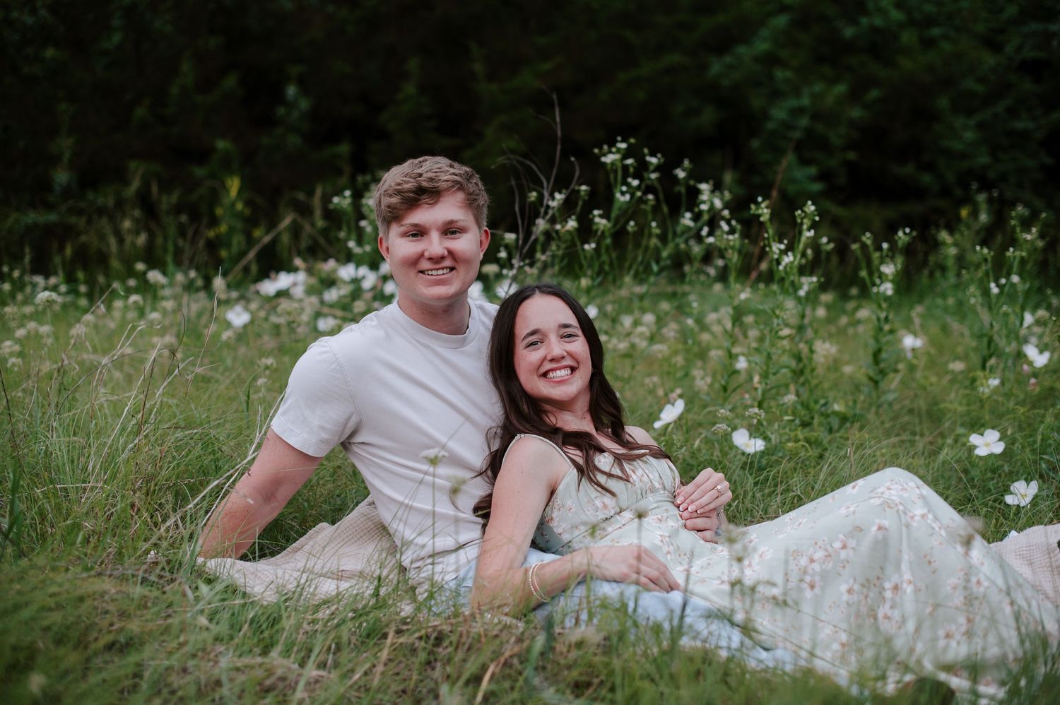 Wichita KS outdoor engagement photos in nature location Andover, couple photos in field with flowers, small elopement wedding photographer