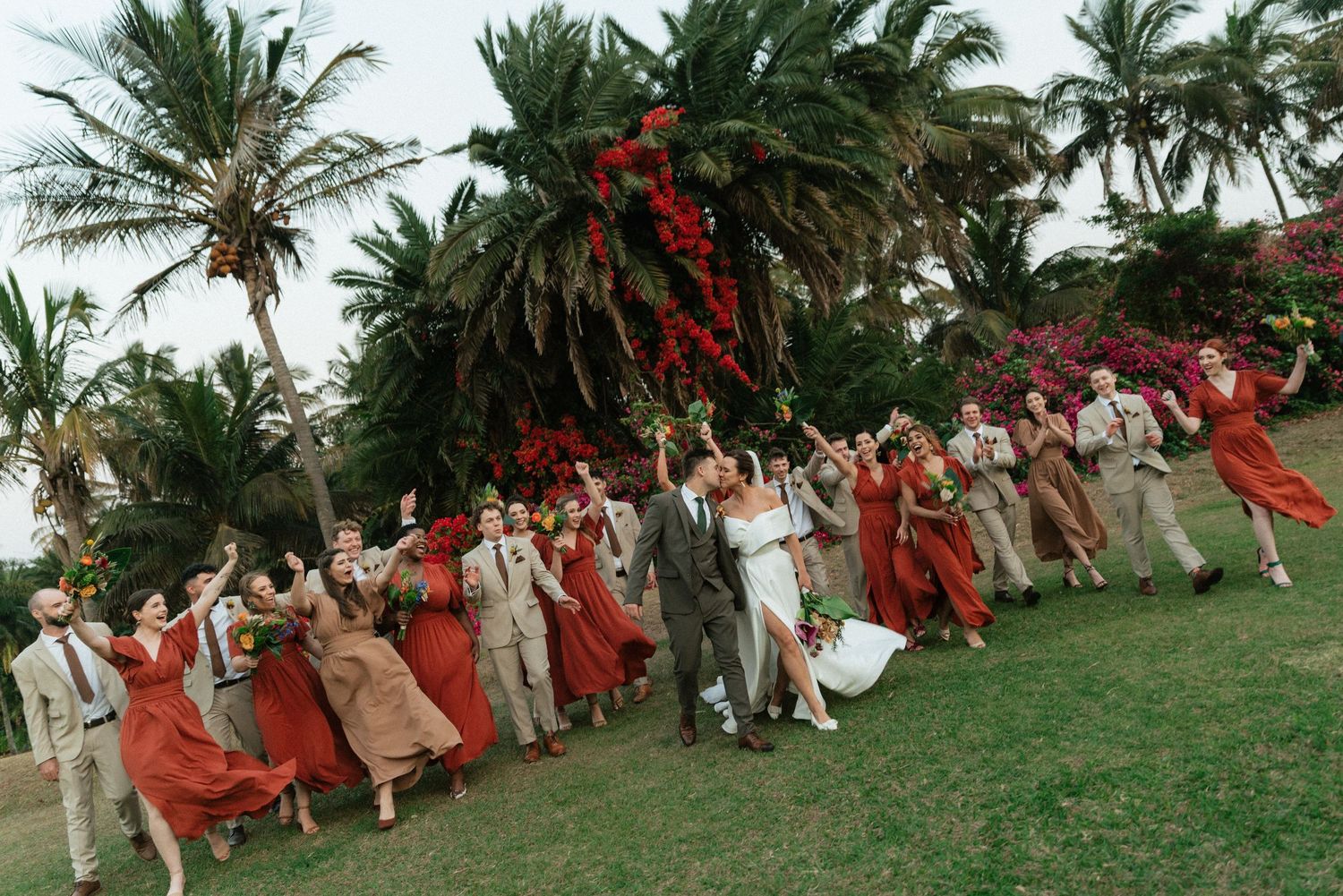 Black and white photo of wedding celebration with confetti toss moment outdoors.