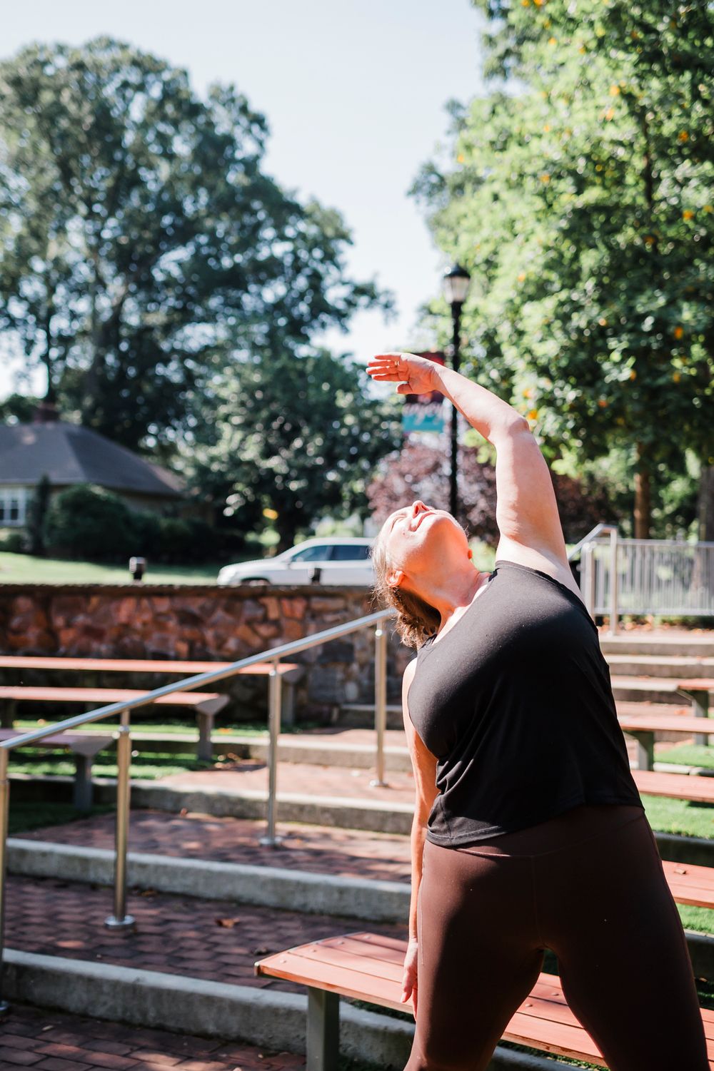 A sequence of photos shows someone in a black shirt pointing and looking up at something in an outdoor park setting.