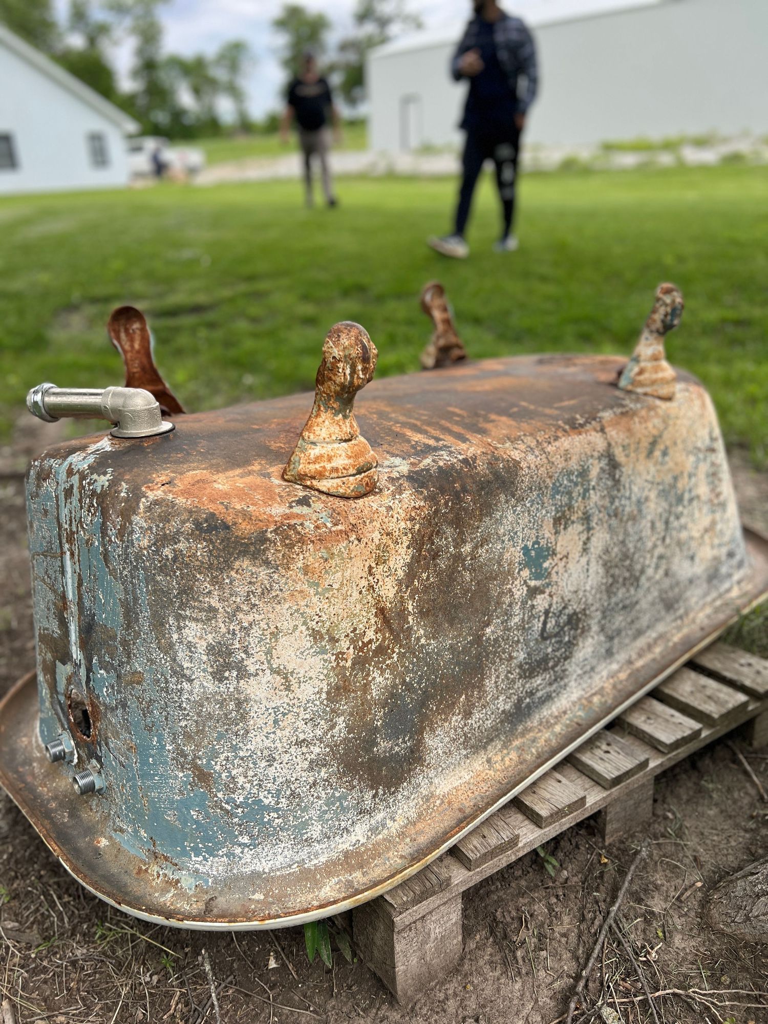 Weathered metal fountain or water feature with rustic patina finish.