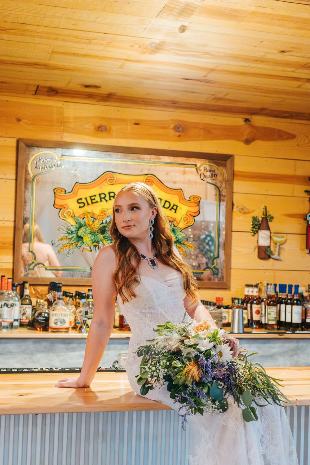 A rustic wooden bar setting with decorative signs and natural lighting.