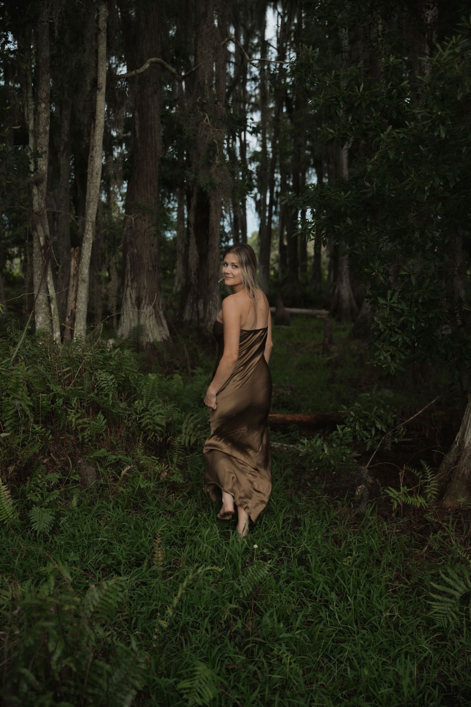 Artistic portrait series in mystical forest setting with natural lighting.