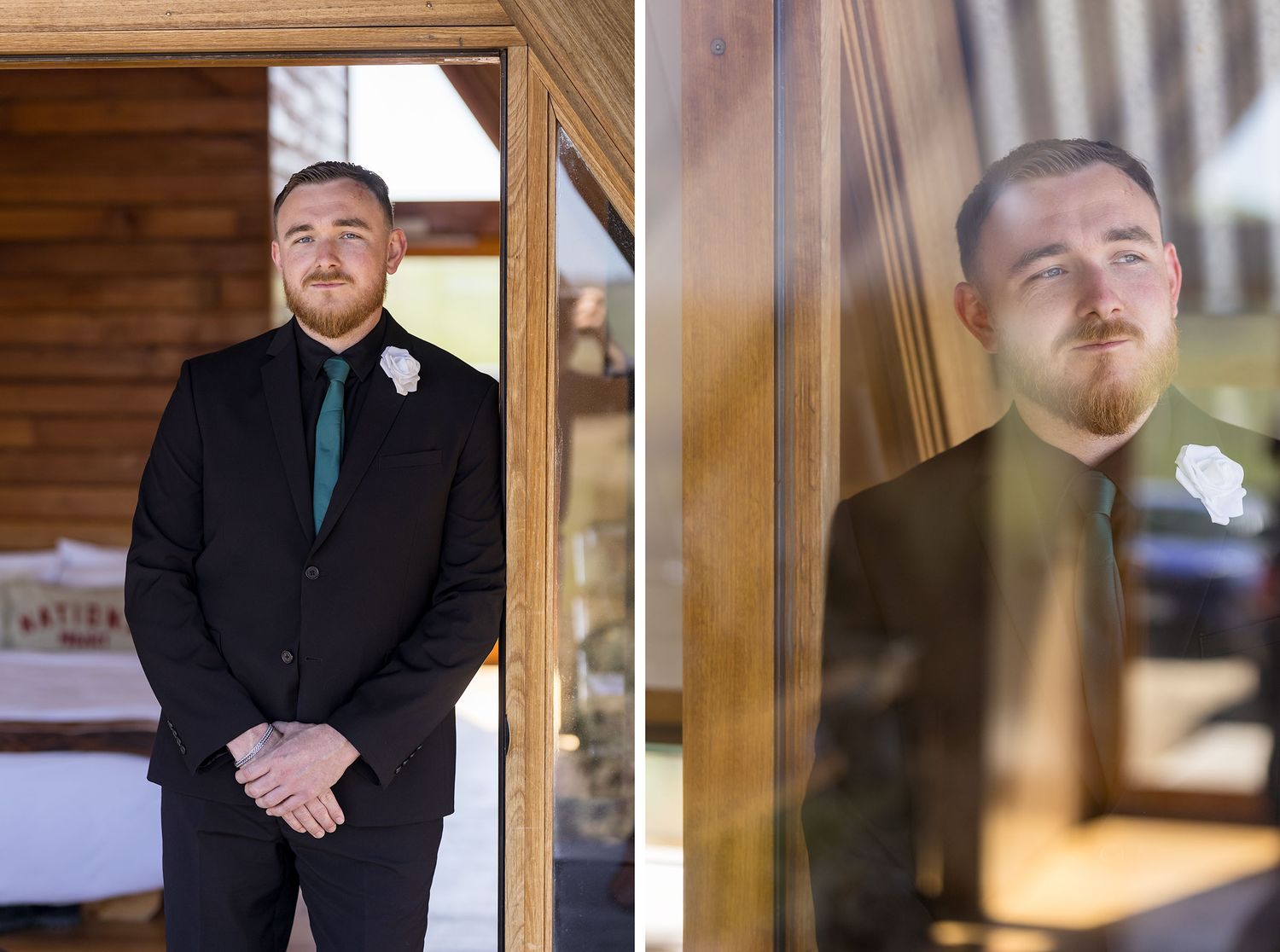 Portrait of a Groom wearing dark suit with a white button hole flower posing in doorway with warm lighting and wooden frame background.
