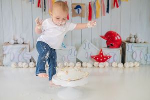 Smash cake photo collage showing a baby celebrating first birthday with colorful banners and cake smashing sequence.