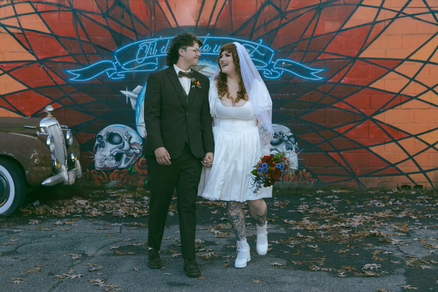 alternative couple mural west asheville elopement ceremony bride groom NC fleetwoods chapel