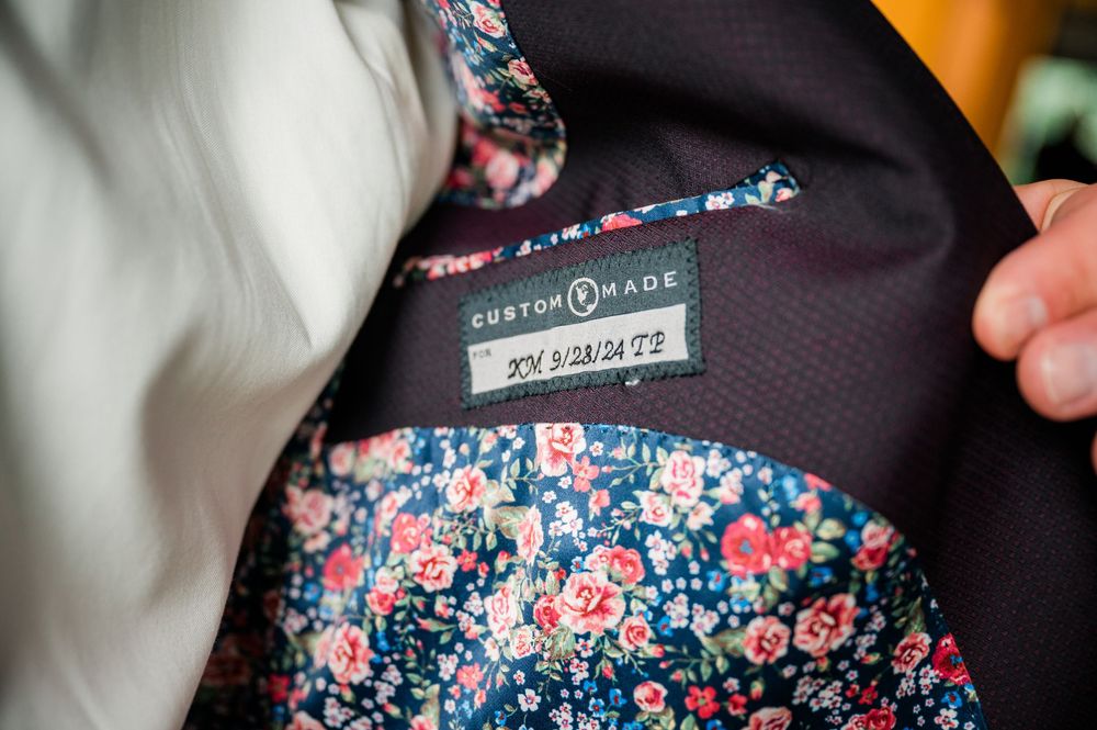 Floral patterned navy blue fabric with pink and blue flowers.