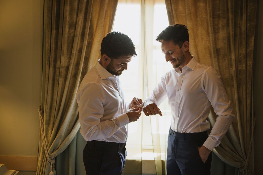 A sequence of candid moments showing two people in white shirts having an intimate conversation by a sunlit window.