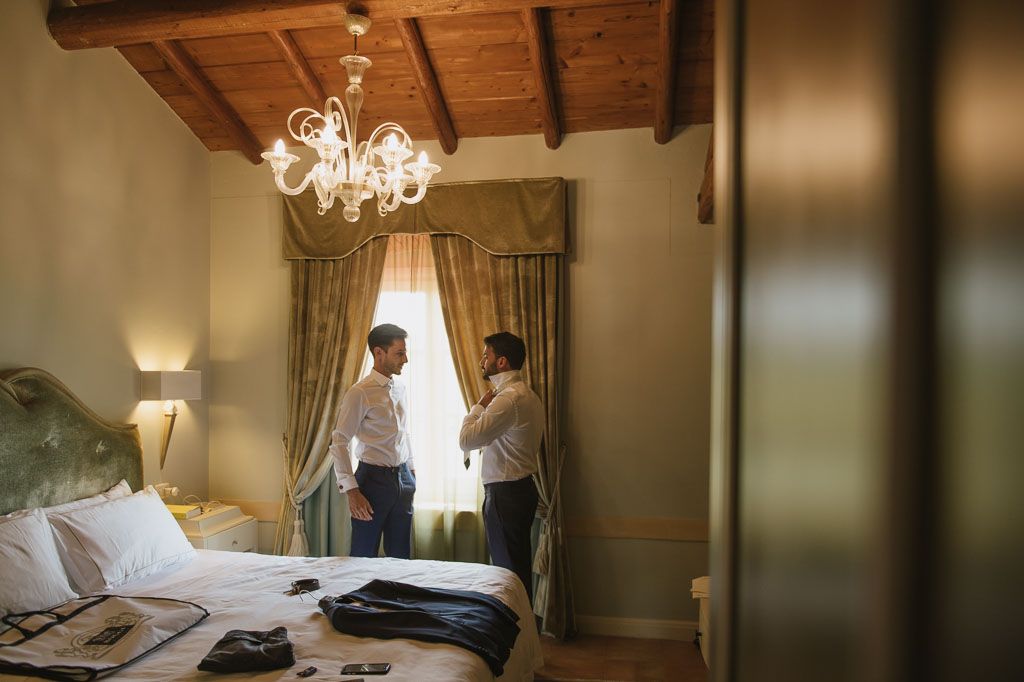 A collage of luxury hotel room interiors featuring elegant lighting, wooden beams, and upscale furnishings.