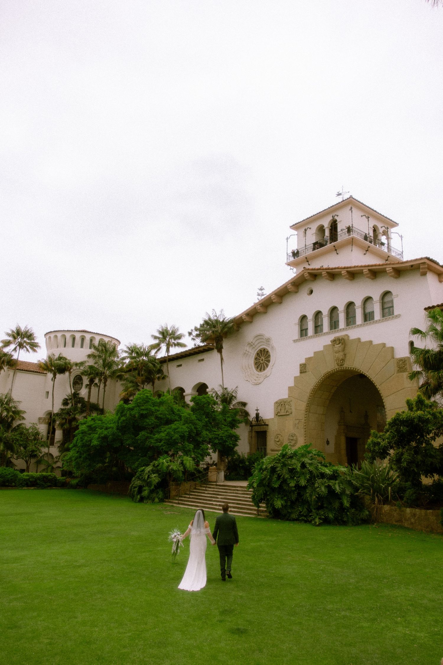 A series of four photos showing the exterior of a Spanish colonial style church building with white stucco walls and arches.