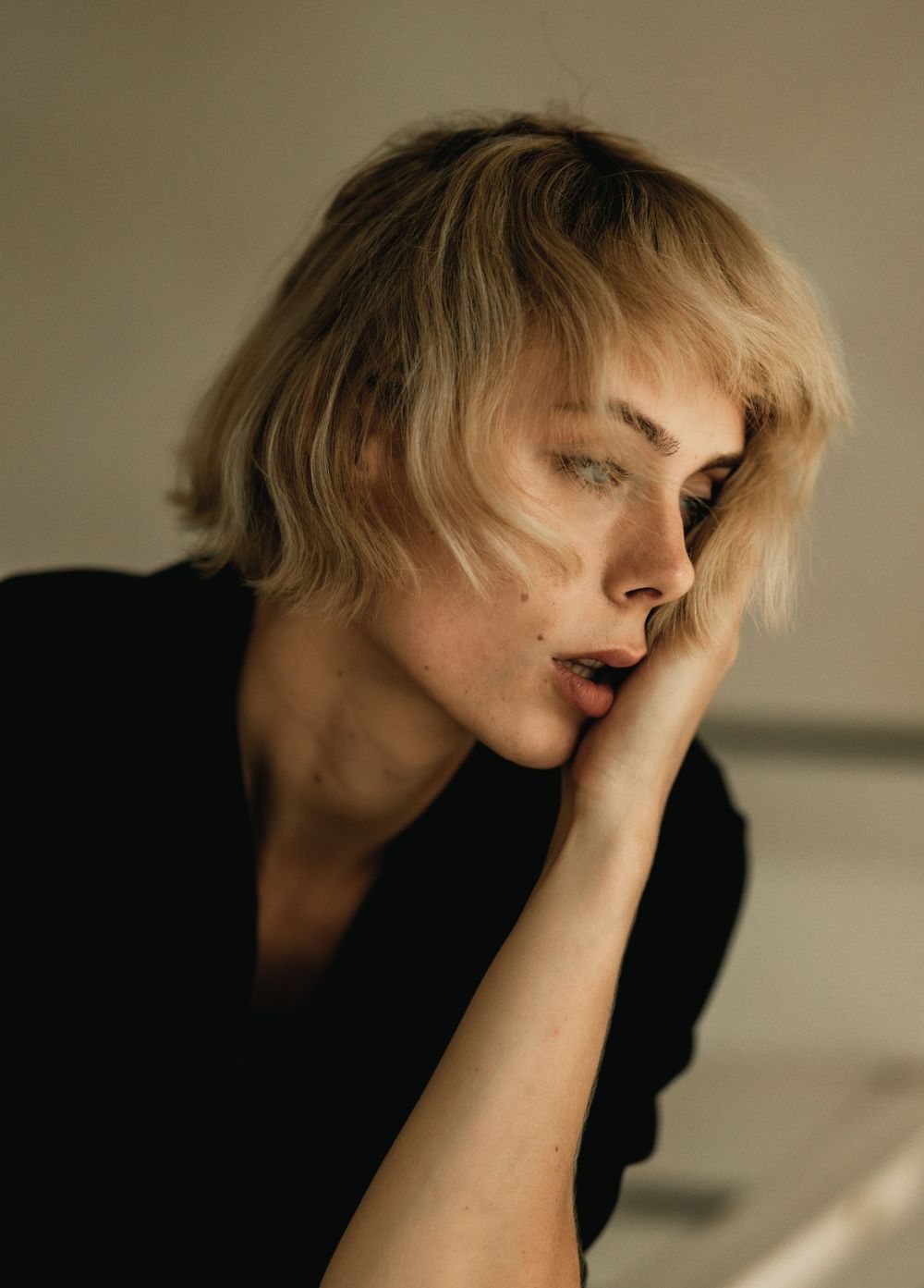 Moody portrait series with dramatic lighting and shadows.