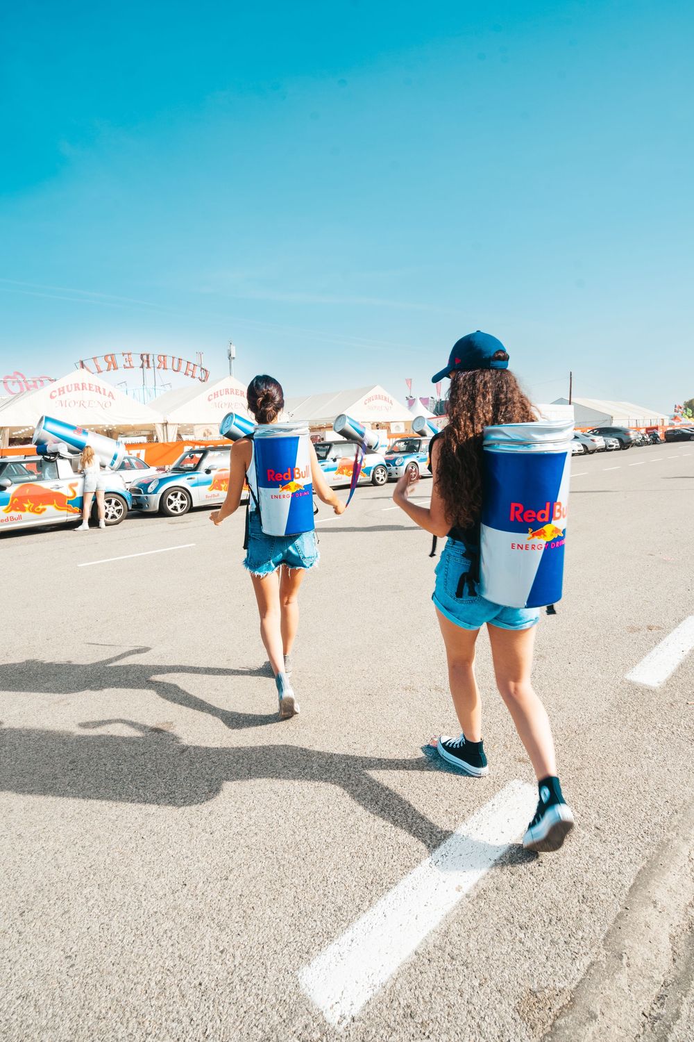 A sequence of five photos showing someone skateboarding with a blue backpack across a white-lined parking lot.