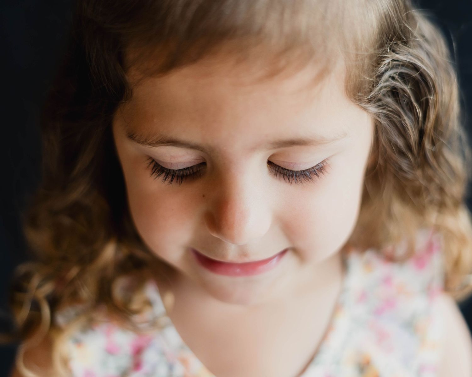 Calm child in natural light setup during a sensory-friendly school portrait session in Melbourne, FL.