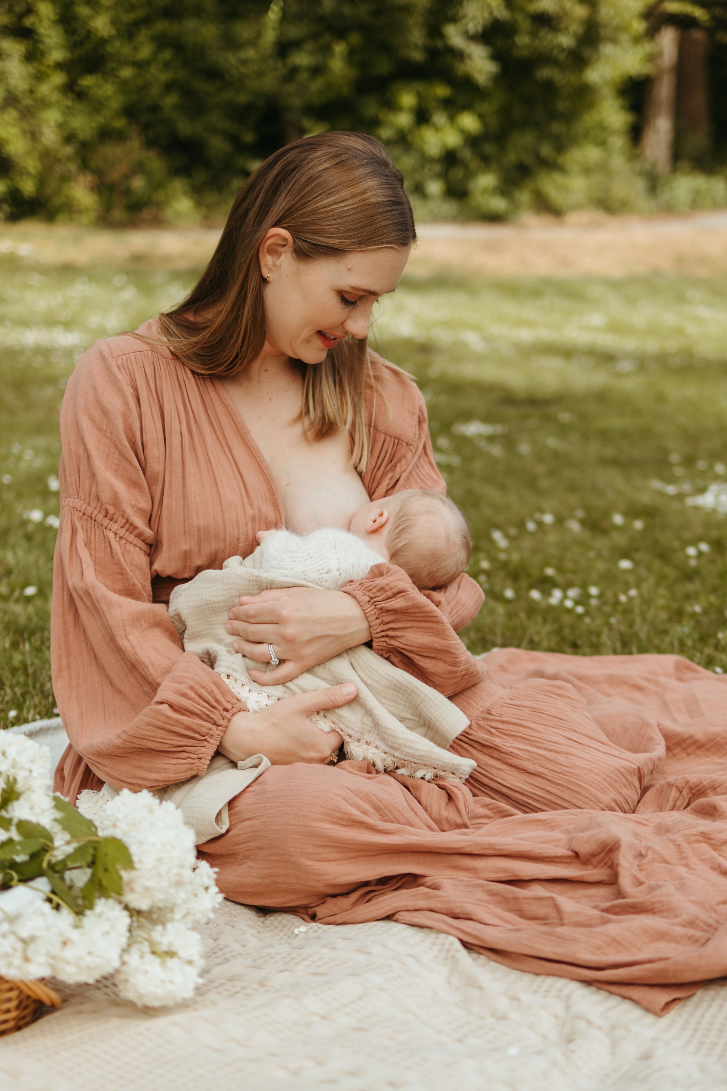 Series of intimate moments showing a person in a flowing peach dress resting on a picnic blanket outdoors.