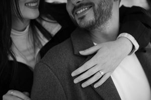 A black and white candid moment showing emotion and joy.